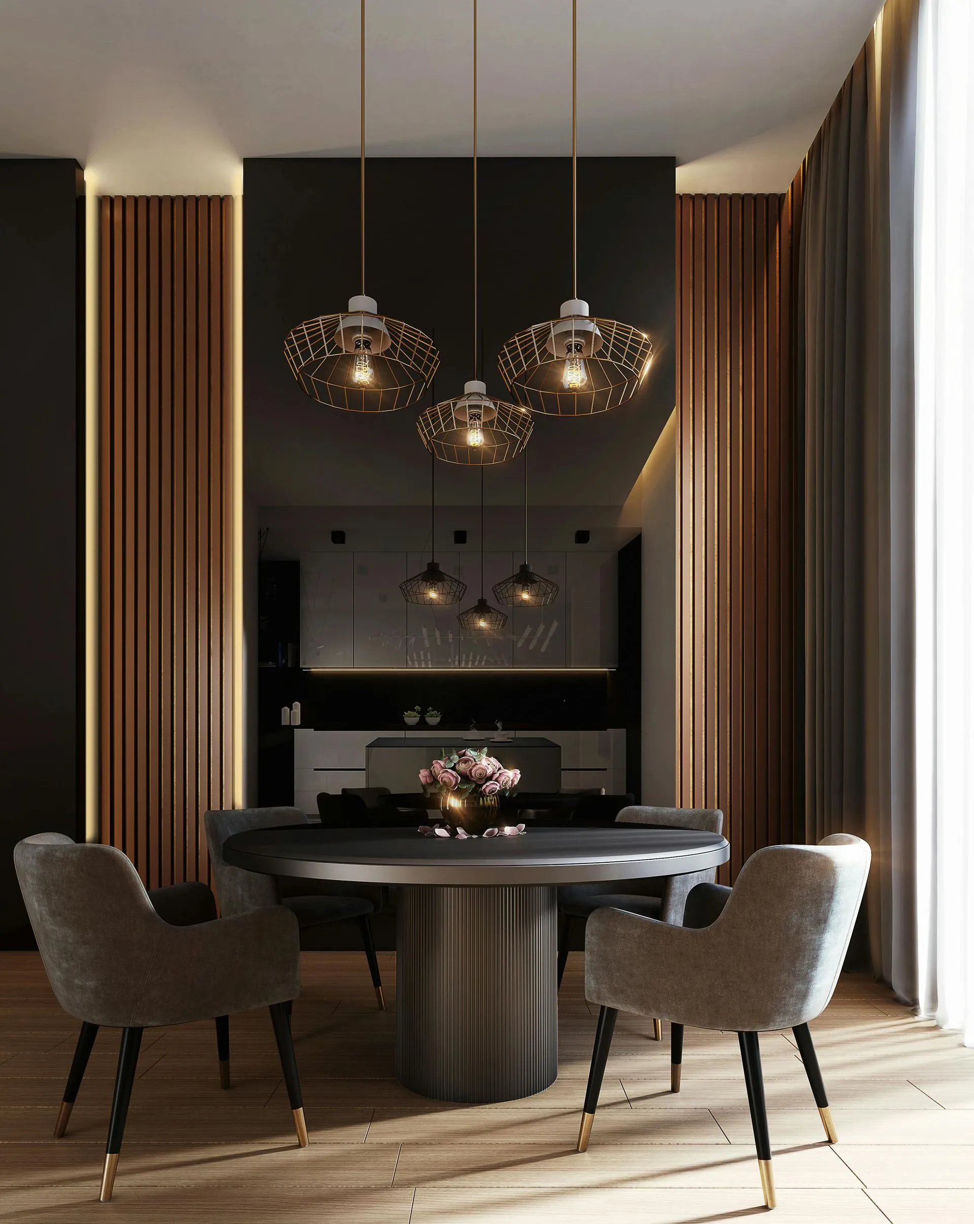 Modern dining room with a round black table, four velvet chairs, pendant lights, wooden accents, and a floral centerpiece on the table.